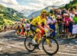 Cycliste en maillot jaune sur route de montagne alpine